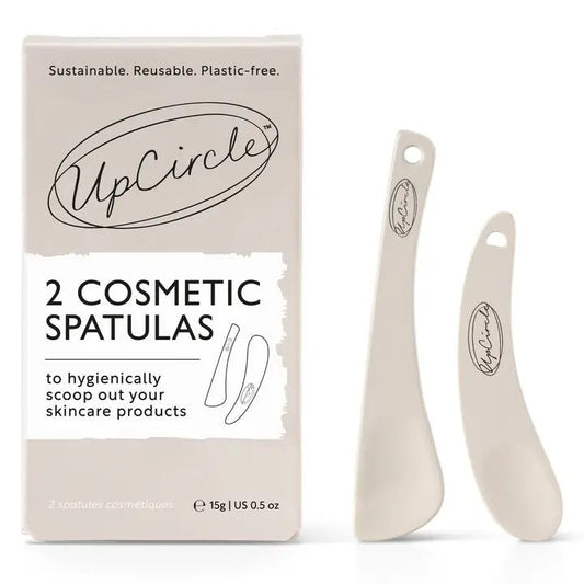 A large and small reusable, eco-friendly spatula for scooping skincare products like cream and balm.