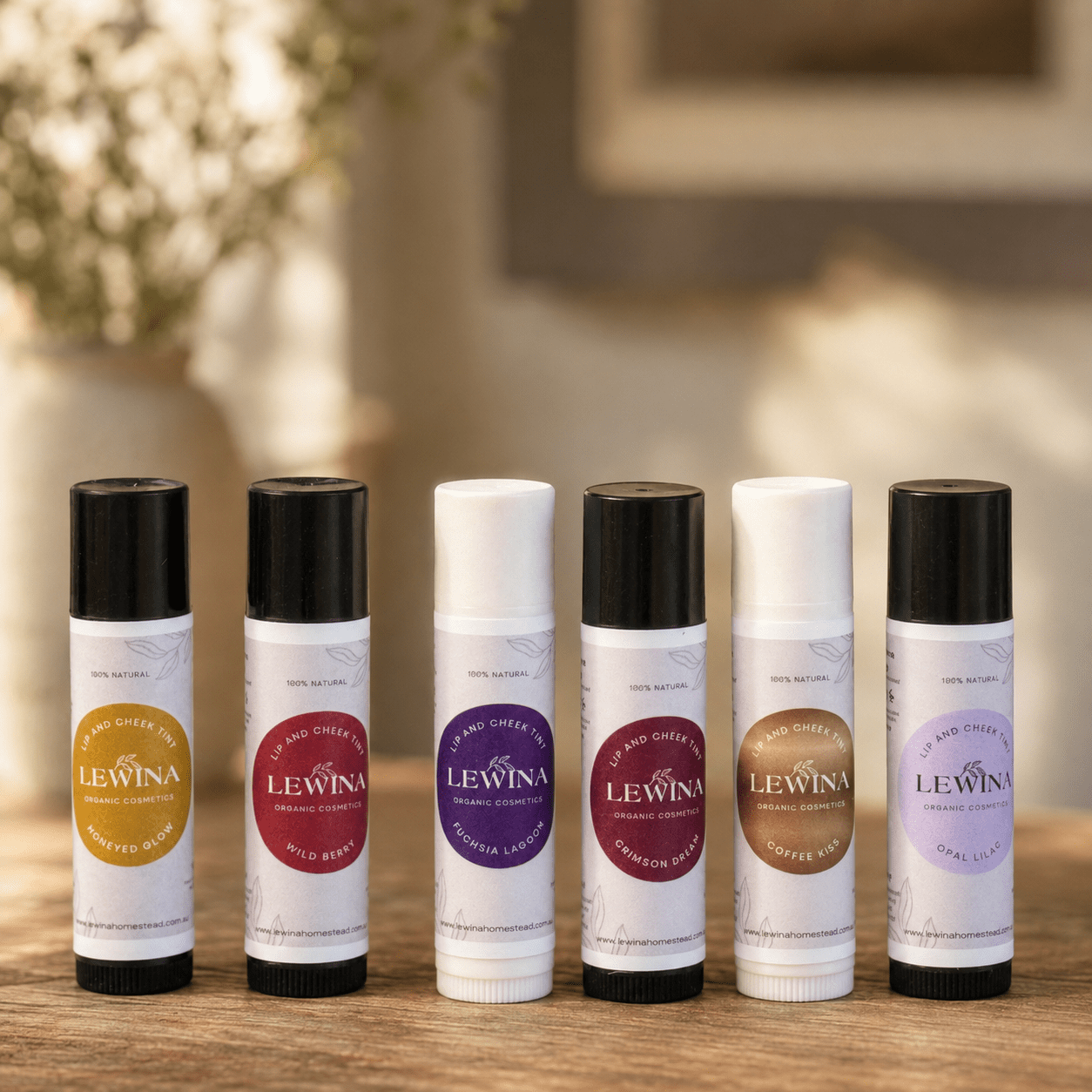 Six Lewina natural Lip and Cheek Tint sticks in assorted shades, handmade in Tasmania
